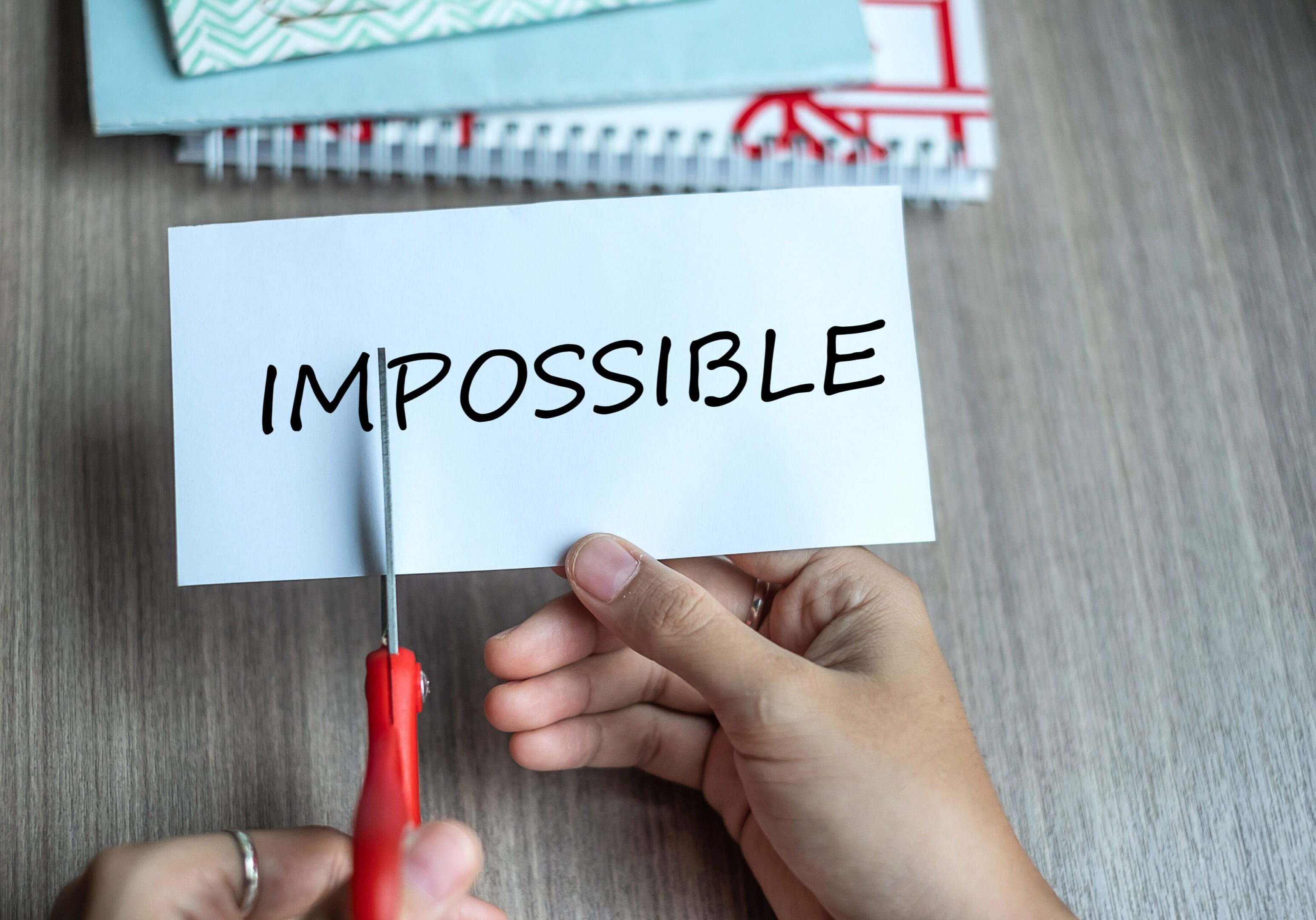 Cutting 'im' from 'impossible' to make 'possible'.